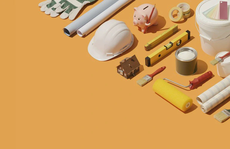 Sprzęt budowlany na&nbsp;pomarańczowym tle